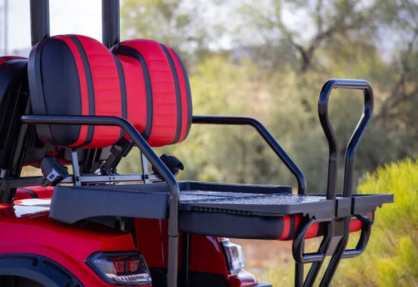 ICON i40L rear flip seats with black handrails and red accent cushions for extra passengers